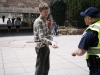 CU student Michael Bramble shows Boulder Police Officer Dan Bergh his BuffOne card at a checkpoint by the Economics building. (Kai Casey/CU Independent)
