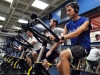 Eric Lenser, 19, a sophomore integrated physiology student (in blue) exercises at the Student Recreation Center. Every semester $84.80 of your student fees go to the Rec Center. (CU Independent/James Bradbury)