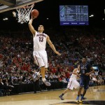 Arizona junior guard Nick Johnson (13) throws down a one-handed dunk on a fast break during the Pac-12 Tournament championship game between UCLA and Arizona Saturday, March 15, 2014, at the MGM Grand Garden Arena in Las Vegas, Nev. (Kai Casey/CU Independent)