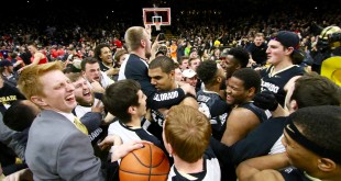 The Buffs celebrate their 75-72 victory over the Arizona Wildcats while the student section storms the court on Feb. 24, 2016. (Nigel Amstock/CU Independent)