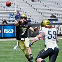 Quarterbacks duel in football spring game