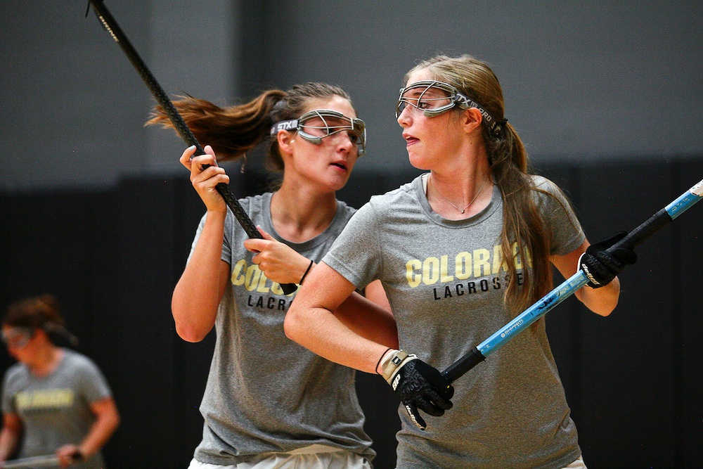 Marie Moore, right, and Annie Morsches run through a ball possession drill during an individuals practice in the Coors Events Center in Boulder, Wednesday, Sept. 11, 2013. (Kai Casey/CU Independent)