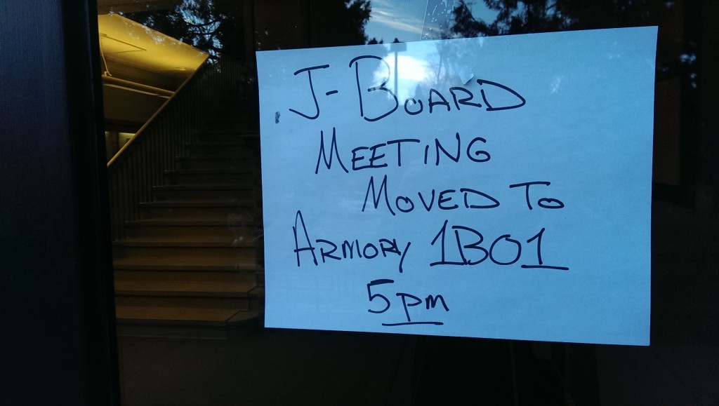 One of two signs that appeared in the University Avenue entryway to the Armory on Thursday. Article V of bylaws proposed to Journalism Board on Thursday stipulated that  all members of the journalism student body be informed if a change occurs to the board's meeting schedule. (Alison Noon/CU Independent)