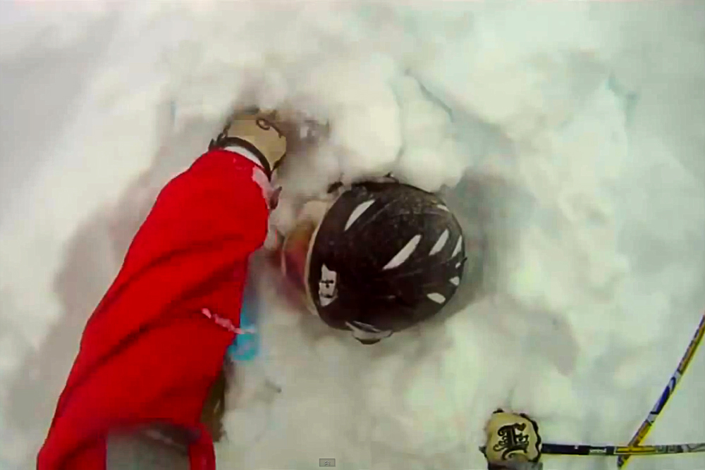 Davis LaMair digs his brother Edwin out of deep snow after Edwin got caught in an avalanche Dec. 22 in the East Vail Chutes. (Screenshot of Davis LaMair's GoPro Video)