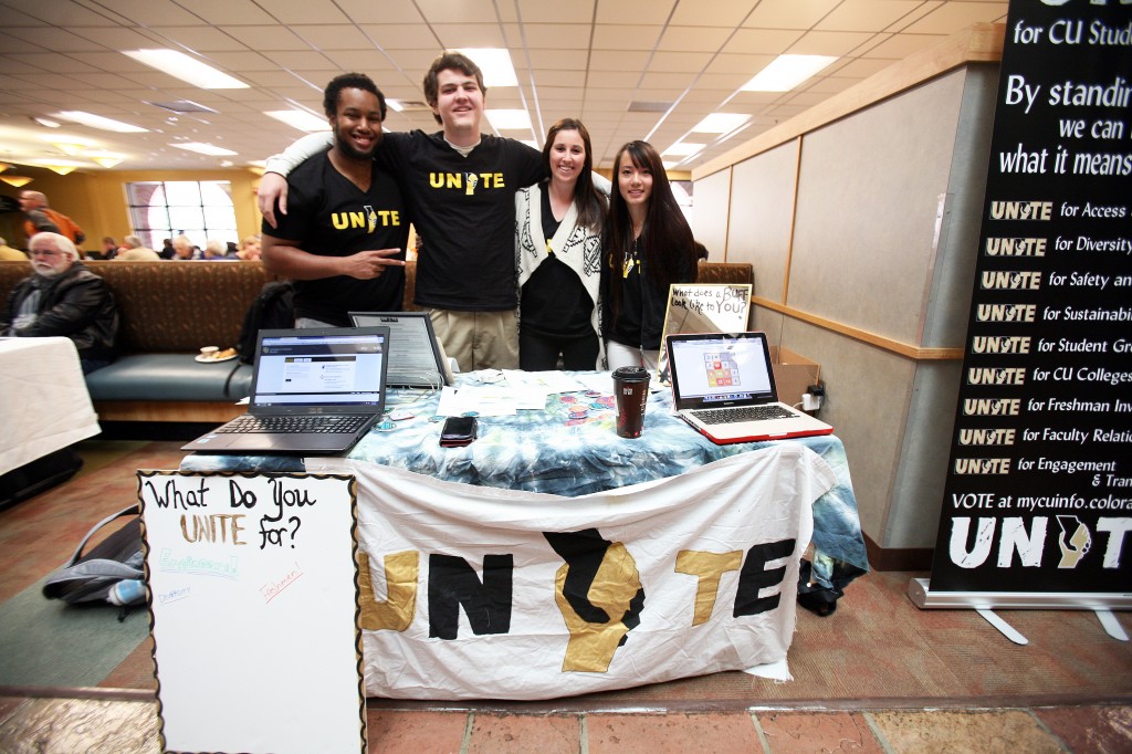 Members of the UNITE ticket (L-R): Juedon Kebede, Tri-Executive-elect, Jon Heisler, candidate for ASSG representative, Lora Roberts, candidate for Tri-Executive, and Thao Bui, volunteer, table in the University Memorial Center during the first day of CUSG Elections, April 7, 2014. (James Bradbury/CU Independent)