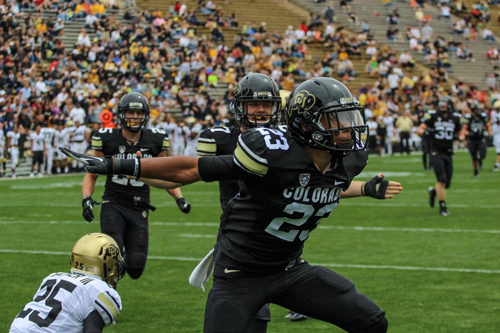 Ahkello Witherspoon celebrates after his game-clinching broken-up pass during the Spring Game on Saturday at Folsom Field in Boulder, Colo. (Matt Sisneros/ CU Independent)