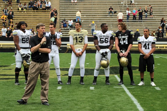 Head coach Mike MacIntyre introduces the five captains for the upcoming season: senior offensive lineman Daniel Munyer (52), junior wide receiver Nelson Spruce (22), freshman quarterback Sefo Liufau (13), senior defensive lineman Juda Parker (56), freshman linebacker Addison Gillam (44), and senior safety, Terrel Smith (41) during the Spring Game, April 12, 2014, in Boulder, Colo. (Matt Sisneros/CU Independent)