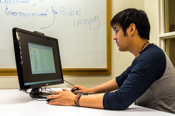 Sophomore business minor Toto Snidvongs, works in a study room in the Koelbel Library. (Matt Sisneros/CU Independent)