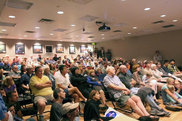 Large crowds of people packed both the main conference room and the lobby of the Laboratory for Atmospheric and Space Physics on Friday to watch NASA's live video covering the Maven Spacecraft entering Mars' orbit. (Gray Bender/CU Independent)