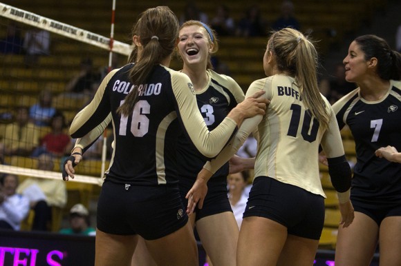 The CU Volleyball team celebrates after a point against Georgia Southern, Saturday, Sept. 6, 2014, at the Coors Events Center in Boulder, Colo. (Matt Sisneros/CU Independent)