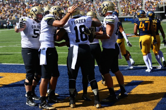 Teammates congratulate freshman full back George Frazier(18) following his touchdown run in the second quarter of play at California Memorial Stadium on Saturday. The Buffs fell to 2-3 (0-2 in Pac-12 play) after the double-overtime loss. (Nigel Amstock/CU Independent)