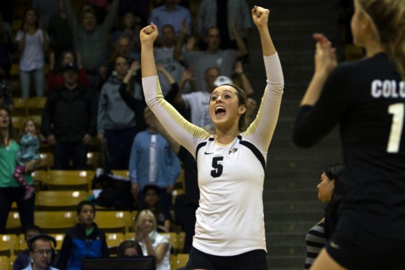 Junior setter Nicole Edelman (5) celebrates with her teammates after scoring the set point to send the game to the fifth set against ASU, Oct. 3, 2014, in Boulder, Colo.  The Buffs took down No. 17 UCLA, but fell to No. 13 USC. (Matt Sisneros/CU Independent)