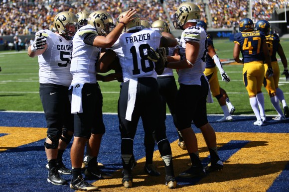 Teammates congratulate full back George Frazier (18) following his touchdown run in the second quarter of play against Cal at the California Memorial Stadium. (Nigel Amstock/CU Independent)