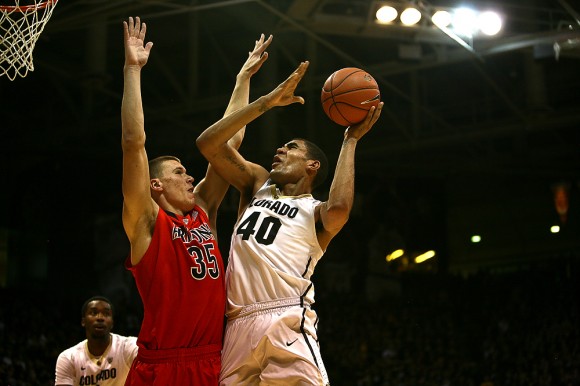 Colorado forward Josh Scott (40) goes up against Arizona's Kaleb Tarczeski (35) for a layup during an NCAA college basketball game between the Colorado Buffaloes and the No. 4 Arizona Wildcats at the Coors Events Center, Saturday, Feb. 22, 2014, in Boulder, Colo. (Kai Casey/CU Independent)