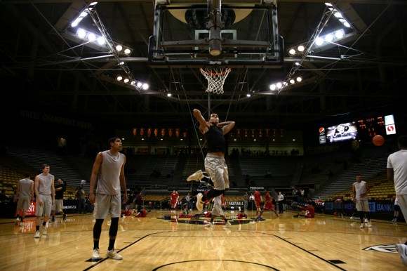 Freshman forward Dustin Thomas goes up for a two-handed tomahawk dunk in warmups before the Buffs tipped off against Washington State on Feb 5, 2014. The Buffs won 68-63. (Matt Sisneros/CU Independent)