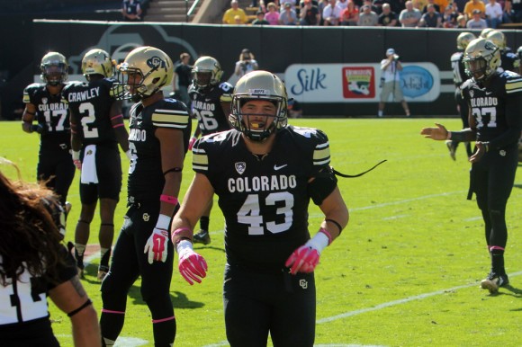 Brady Daigh runs off the field to the bench on Oct. 4, 2014. The Buffs fell 36-21 to Oregon State. (Alexandra Greenwood/CU Independent)