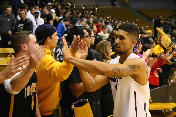 Askia Booker high fives fans following the Buffs 65-48 victory over the Drexel Dragons at the Coors Event Center. (Nigel Amstock/CU Independent)