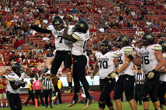 Jordan Gehrke (7) celebrates a touchdown with teammate Malcolm Creer (10) in the second half of the game against USC on Oct. 18, 2014. (Gray Bender/CU Independent)