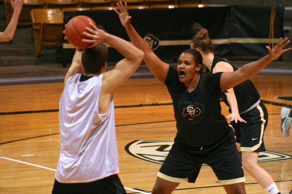 Sophomore center Bri Watts (3) guards her opponent from passing the ball. (Allie Greenwood/CU Independent)