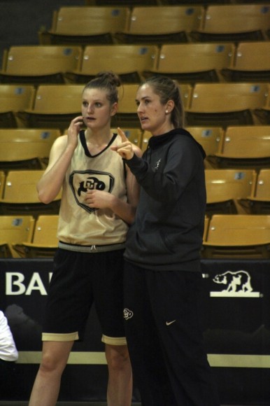 Assistant coach Kelly Rae Finley instructs freshman Alina Hartmann (20) in preparation for the upcoming games. (Alexandra Greenwood/CU Independent)