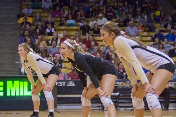 The Simpson sisters, Gabby (13), Cierra (10) and Taylor (6), get ready to receive a serve during a tough game against Stanford earlier in the season. The women's volleyball team currently stands with an overall 15-10 record for the 2014 seasons, and still has home games against Washington, Washington State, and Oregon State. (Matt Sisneros/CU Independent)