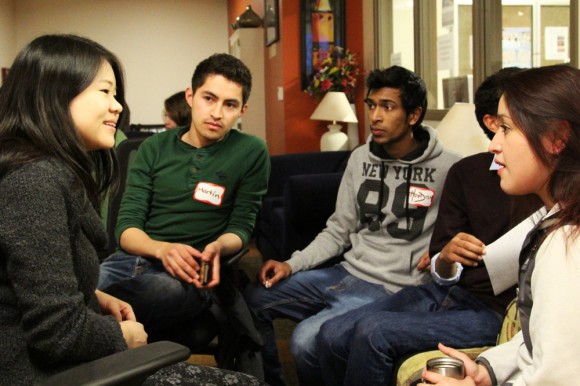 CU Boulder students (left to right) Moeko Kubota, sophomore marketing major, Martin Castarena, senior biology major, Hoodish Domun, freshman finance major, Abdullah Alhashash, freshman accounting major, and Natalia Marroquin, junior environmental design major, discuss ideas as part of the graphics team of the International Students & Scholars Program in the C4C on Jan. 15th, 2014. This group is one of many committees preparing for the International Festival on April 11th. (Sarah Meisel/CU Independent).