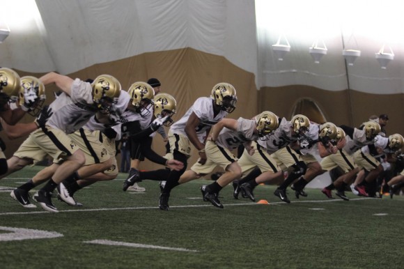 The Buffs football team practices in the varsity sports bubble before their 2014 season than ended with only two victories out of a total of twelve games. (Matt Sisneros/CU Independent)