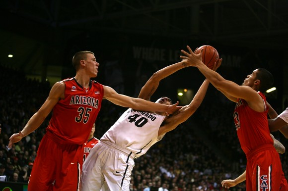 Colorado's Josh Scott (40) tries to grab a rebound during last season's home game against No. 7 Arizona on Feb 22, 2014. Despite their loss at home last season, the Buffs will look to beat the Wildcats this Thursday at 7:00pm in Coors Event Center. (Kai Casey/CU Independent)