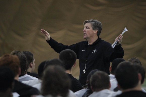 Head coach, Mike MacIntyre, addresses the team at the end of practice one year ago in the sports bubble. After another challenging fall season for the Buffs, new strategies will be key in their success during the upcoming fall 2015 season. (Matt Sisneros/CU Independent)
