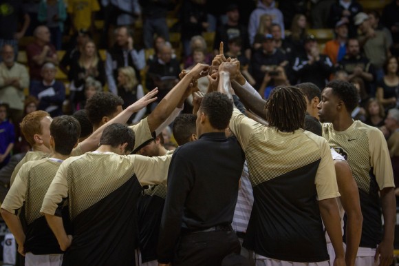 The CU basketball team huddles up before the opening tip during the first half of the 2014-2015 season.  The Buffs will play California on Thursday Feb. 12, 2015 at 7:00pm. (Matt Sisneros/CU Independent)