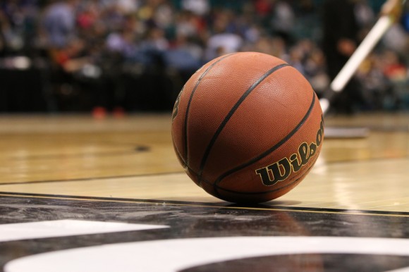 A basketball sits on the court during warm up. (Gray Bender/CU Independent)