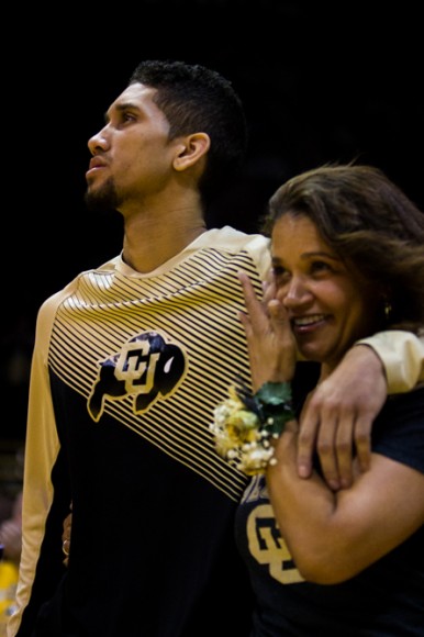 Senior Askia Booker hugs his mother as she tears up during the senior night celebrations at Coors Event Center on Sunday March 1, 2015. (Robert Hylton/CU Independent)