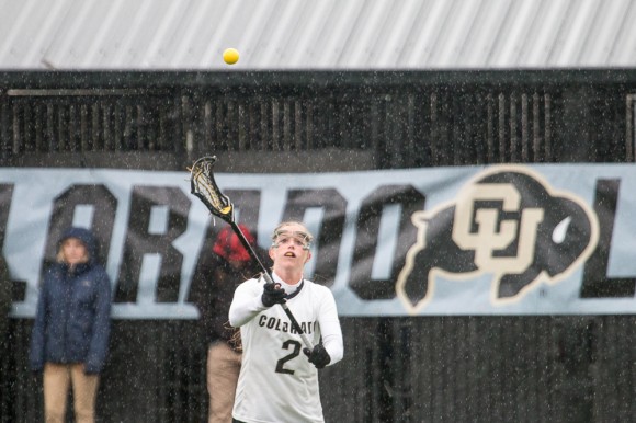 Sophomore midfielder Marie Moore passes to a teammate. Moore had a goal in CU's 8-6 win over Oregon. (Matt Sisneros/CU Independent)