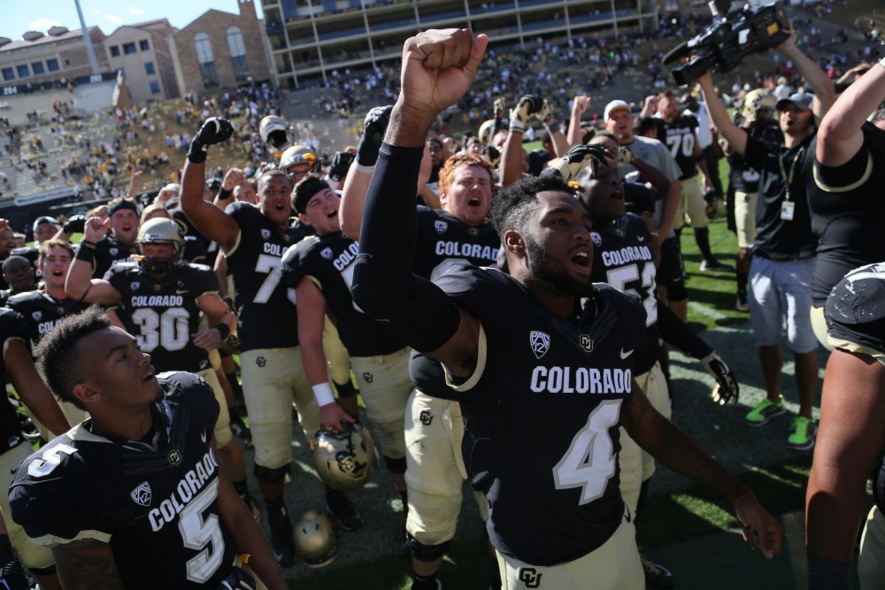 The Buffs celebrate their 48-14 victory over the UMass minutemen at Folsom Field. (Nigel Amstock/CU Independent)