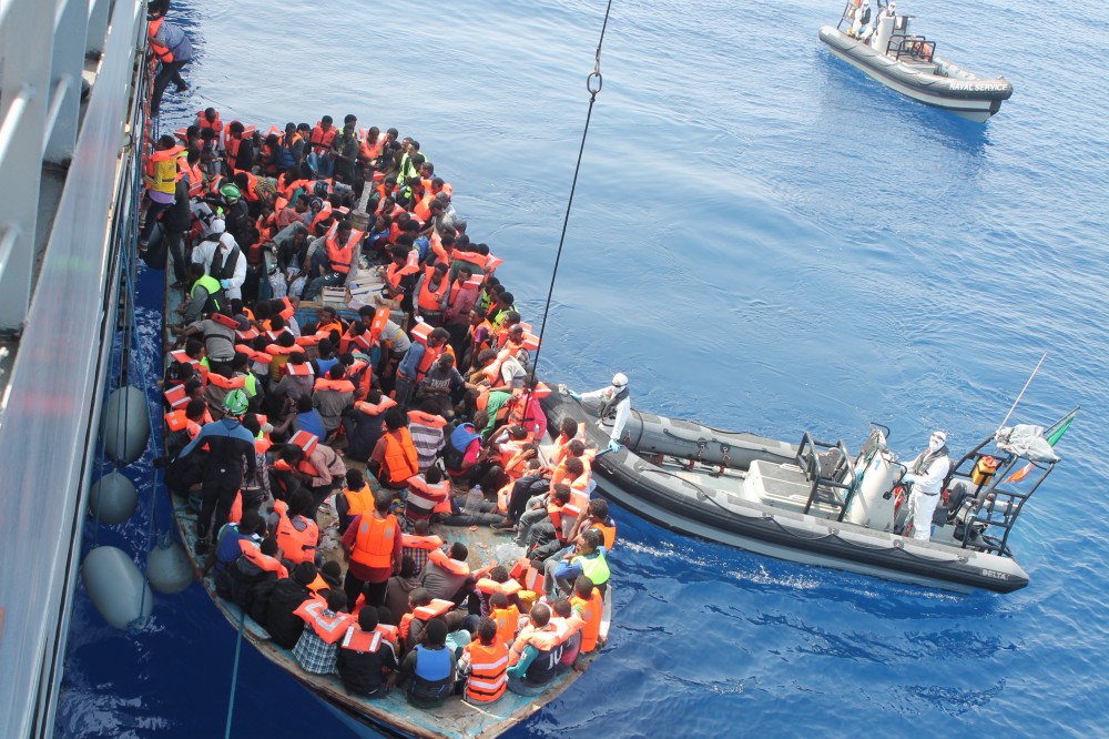 Irish Naval personnel from the LÉ Eithne (P31) rescuing migrants as part of Operation Triton. (Photo courtesy of Tomh903/Wikimedia Commons) 