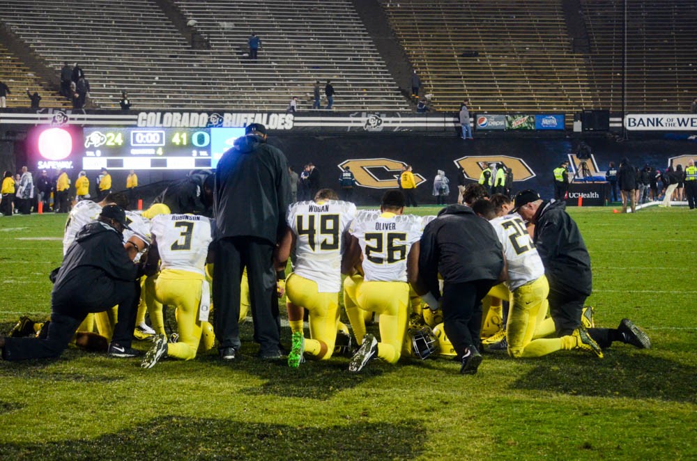 After the win, 41-24, by the Oregon Ducks came together as a team and prayed on the field. (Elizabeth Rodriguez/CU Independent)