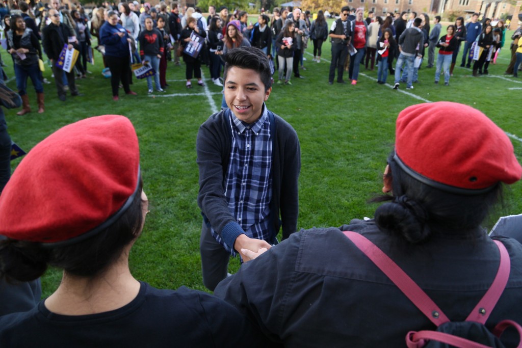 A young latino community member thanks protesters from the Aztlán community for coming out to the My Country, My Vote pro immigration rally on Farrand Field. (Nigel Amstock/CU Independent)