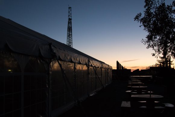 The sun rises over the tent that will house voters at the UMC. (Jackson Barnett/CU Independent)