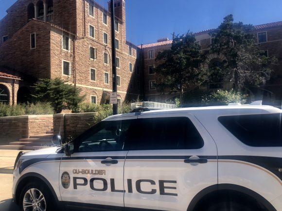 CUPD car outside of Farrand Hall