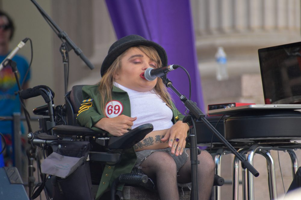 Kalyn Rose Heffernan, queer and disabled Denver Mayoral candidate, performing with Wheelchair Sports Camp.