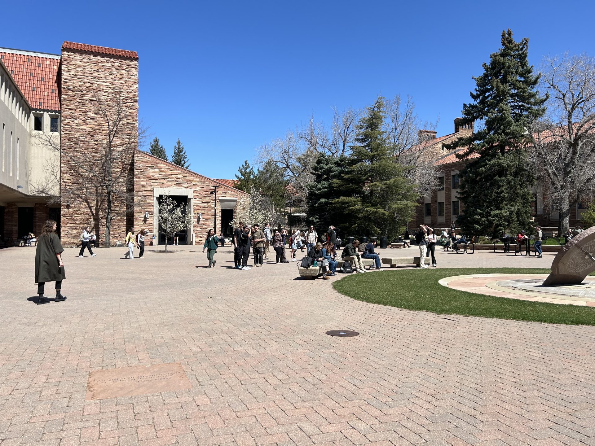 CU Boulder students gather outside to witness partial solar eclipse